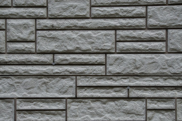 texture of stone masonry, gray background, multi-colored stone b