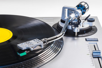 A modern record player playing an album