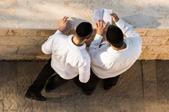 Two Jewish men praying before the Jewish New Year, early morning