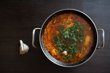 red soup with herbs