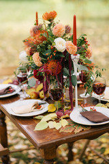 The holiday table decorated with flowers.