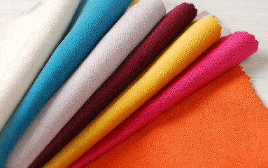 Bright collection of colorful velour textile samples. Fabric texture background