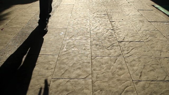 Moving shadows of walking people