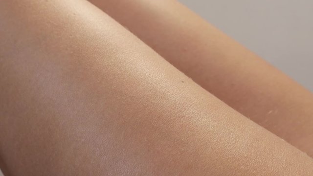 Woman leg skin checking for potential cellulite presence 4K 2160p 30fps UltraHD footage - Adiposis edematosa orange peel syndrome female problem seeking 3840X2160 UHD video 