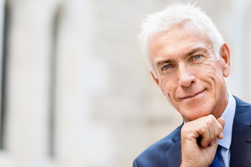 Portrait of confident businessman outdoors