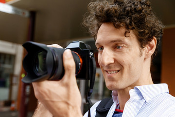 Male photographer taking picture