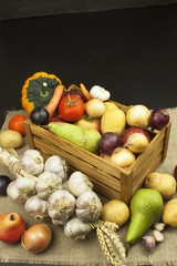 Vegetables and apples on wooden table. Autumn harvest on the farm. A healthy diet for children.
