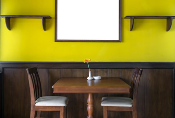 Luxury restaurant set with yellow color wall with big photo fram