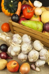Vegetables and apples on wooden table. Autumn harvest on the farm. A healthy diet for children.
