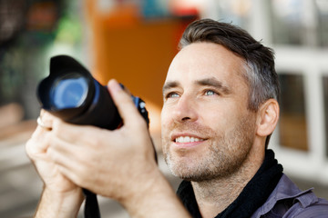 Male photographer taking picture