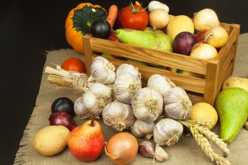 Vegetables and apples on wooden table. Autumn harvest on the farm. A healthy diet for children.
