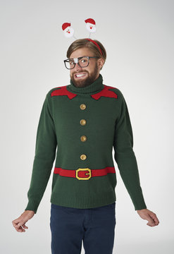 Cheerful man in Christmas jumper.