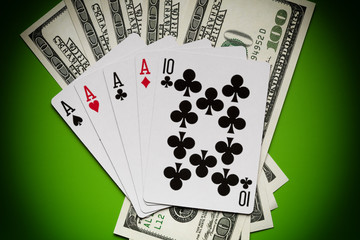 Playing cards and dollar bills