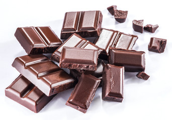 Pieces of chocolate bar isolated on a white background.