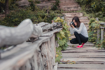 Fototapeta premium Beautiful young woman portrait wit old camera.