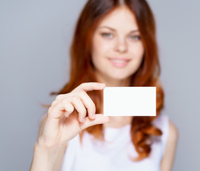 Hand holding blank business card isolated
