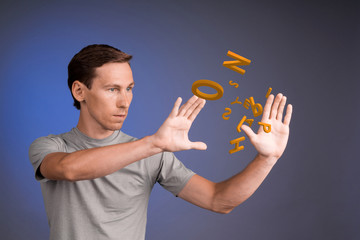 Man working with a set of letters, writing concept.