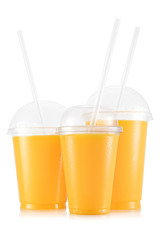 Orange juice in three size of cups - obrazy, fototapety, plakaty
