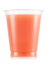 Grapefruit juice in plastic cup - obrazy, fototapety, plakaty