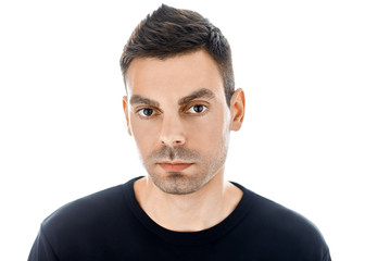 Fototapeta premium Closeup portrait of young handsome man isolated on white backgro