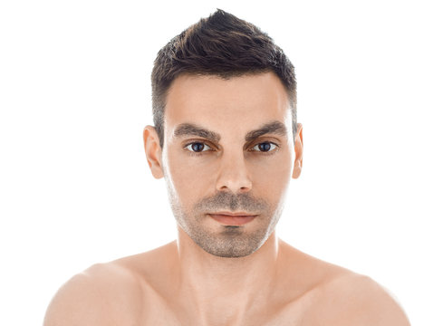 Closeup portrait of young man with healthy clean skin isolated o