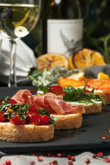 Set bruschetta with fish, greens and meat