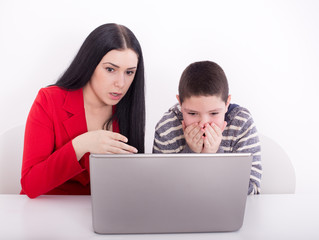 Sister and brother looking at laptop