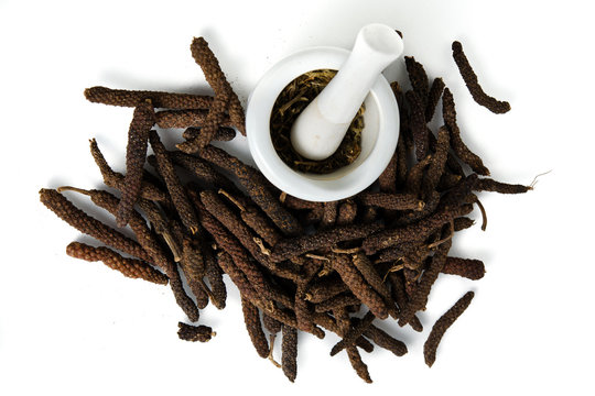 Long pepper or Pipli or Dipli (Piper longum) isolated on white b