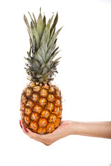 A girl holding a pineapple on a white background.