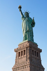 Obraz premium Statue of Liberty against blue sky in New York City, United States of America