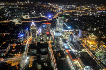 Fototapeta na wymiar Aerial night view of Taipei, Taiwan with brightly lit streets and buildings glowing across the city