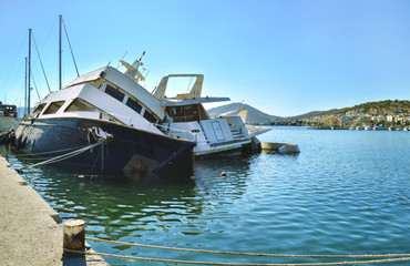Naklejka premium sunk boats at the port of Salamis Greece