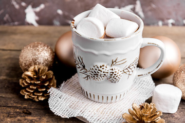 Hot cocoa with marshmallow and christmas ornaments 