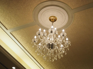 chandelier with lighting on the wall