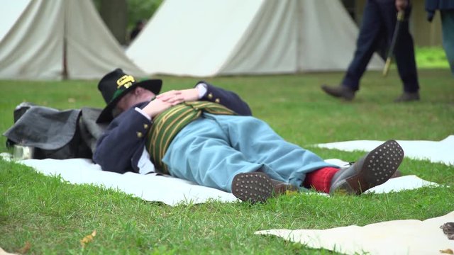 Civil War soldier napping in camp