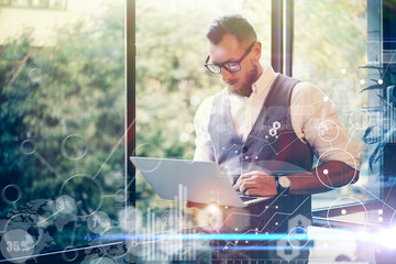 Concept Global Strategy Graph Virtual Icon Diagram.Innovations Searching Interface.Bearded Businessman Wearing Glasses White Shirt Waistcoat Texting Message Modern Laptop His Hand. Blurred Background.