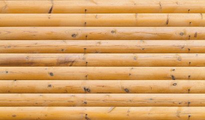 Wooden wall made of logs, texture