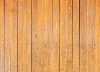 Wooden wall with yellow paint layer