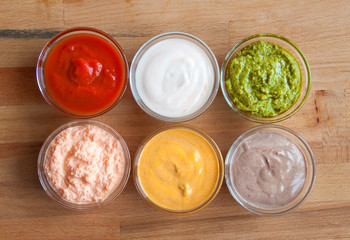 Assorted sauces on wood