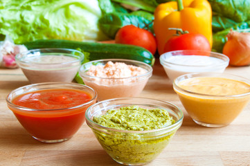 Assorted sauces on wood