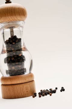 pepper grinder, black pepper on white background