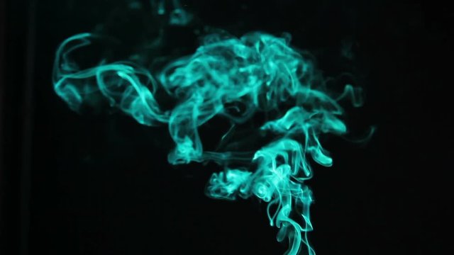 Green smoke is dissolved in the dark