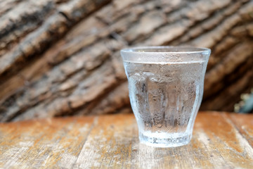Glass water on wooden table.