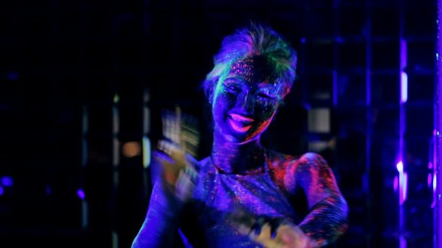 girl dancing in the ultraviolet light