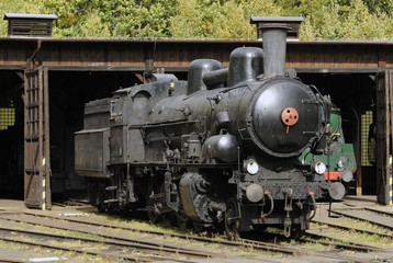 Obraz na płótnie Canvas Old Vintage Steam Locomotives At The Train Depot