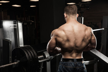 Fototapeta na wymiar Muscular athletic bodybuilder fitness model posing