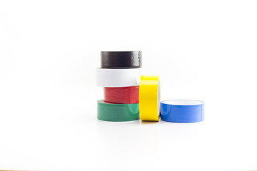 Multicolored adhesive insulating tapes roll isolated on white background.