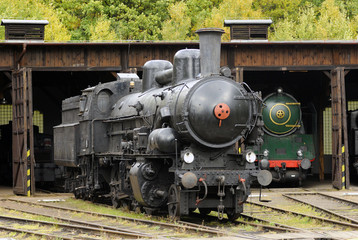 Fototapeta na wymiar Old Vintage Steam Locomotives At The Train Depot
