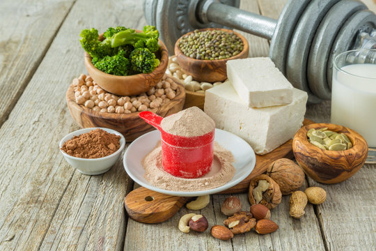 Selection vegan protein sources on wood background