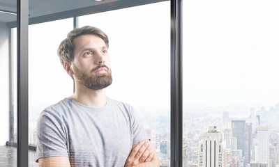 Man in T-shirt dreaming about his bright future